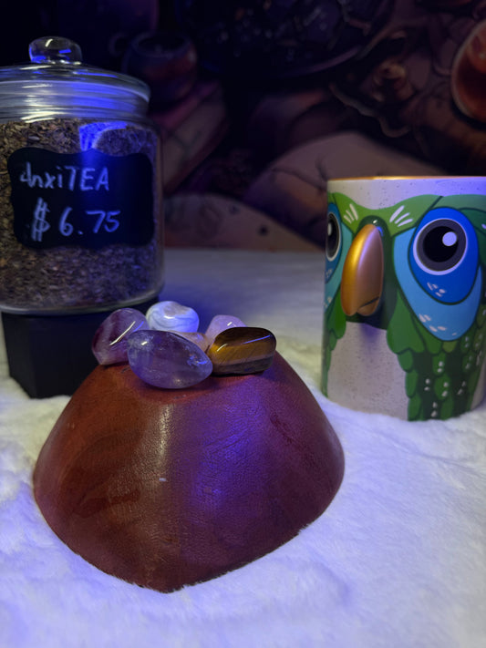 Herbal tea jar with crystals and owl mug – metaphysical apothecary product display