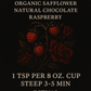 Bloodberry Oath tea back label with ingredients list, steeping instructions, and ritual description, framed by raspberries and roses on a black background.