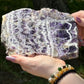 Front-facing view of a dreamy chevron amethyst slab displaying bold V-shaped quartz banding, ideal for spiritual healing and third eye activation.