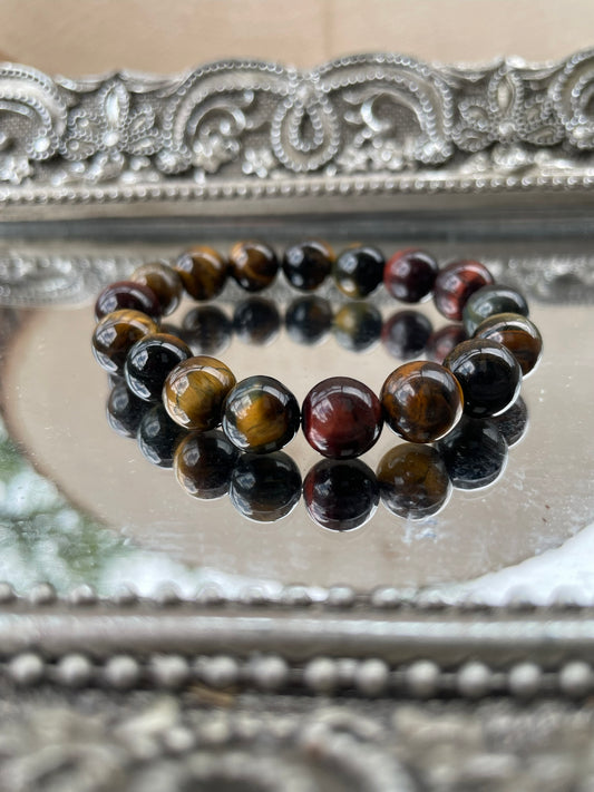 Handmade Tiger’s Eye bracelet displayed with polished brown and golden beads, symbolizing strength, grounding energy, and chakra alignment
