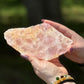 Front view of polished Rose Quartz with Golden Healer slab, displaying soft pink tones and radiant golden veining in natural daylight.