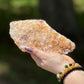 Back view of a Rose Quartz with Golden Healer slab showing raw natural texture with golden-orange mineral inclusions.