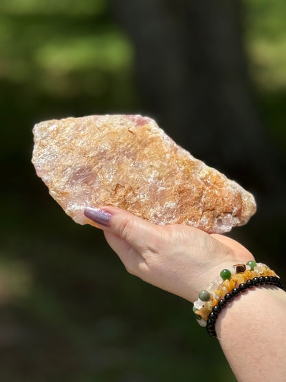 Back view of a Rose Quartz with Golden Healer slab showing raw natural texture with golden-orange mineral inclusions.
